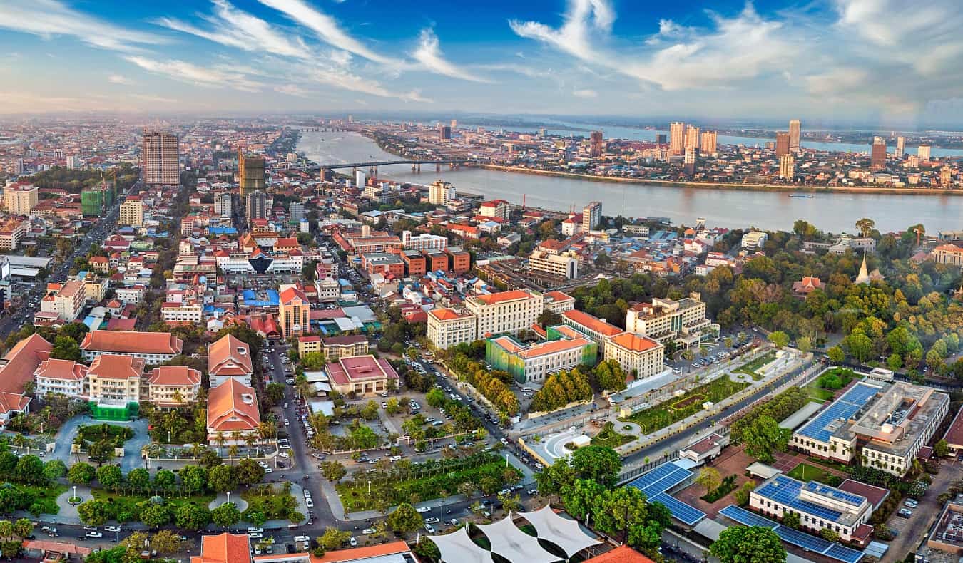 Aerial view over the cityscape of Phnom Penh, Cambodia“/></noscript><br />
Founded in 1434, <a href=